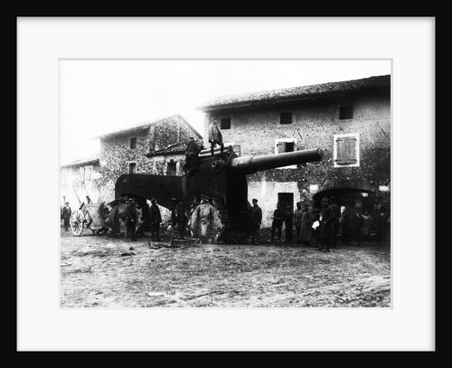 German troops examine heavy and gigantic cannons deserted by fleeing Italians in a village behind Udine. by Anonymous