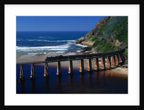 Train Crossing River on Trestle Bridge by Anonymous