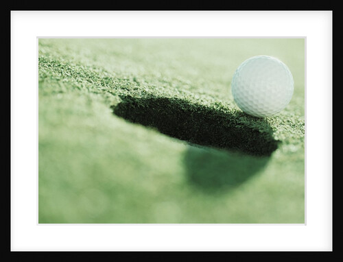 Golf Ball on the Edge of the Hole by Anonymous