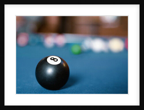 Eight ball on pool table by Anonymous