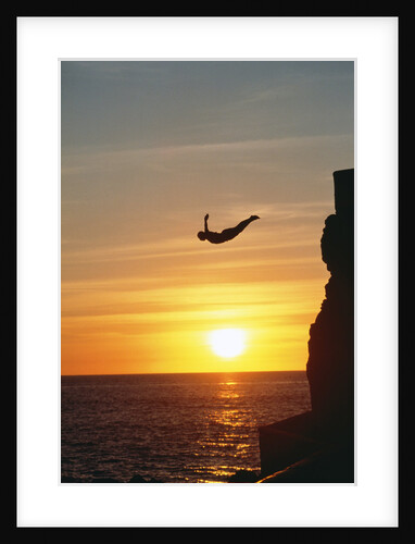 Cliff Diver Above Setting Sun by Anonymous