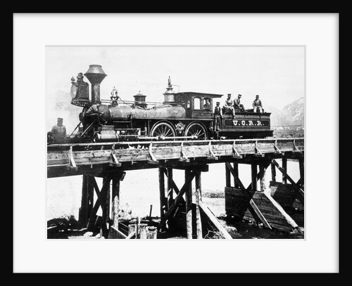 Steam Locomotive Passing over Trestle Bridge by Anonymous