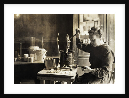 Woman Filling Toothpaste Tubes by Anonymous