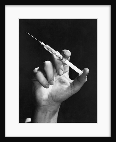 Hand Holding Syringe by Anonymous