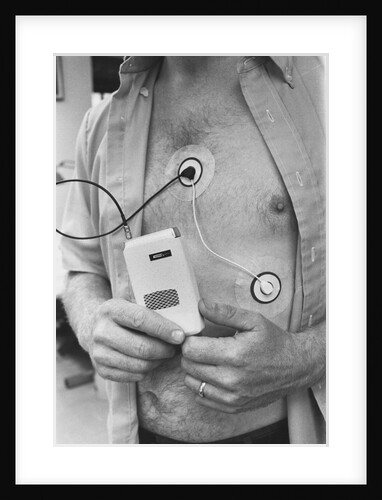 Man Attached and Holding to Medical Device by Anonymous