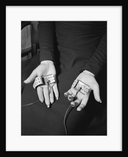 Pair of Hands Wearing Lie Detector Device by Anonymous