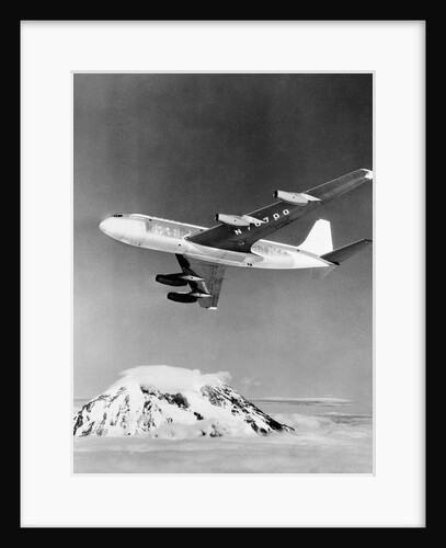 Large Aircraft Flying over Mountainous Region by Anonymous