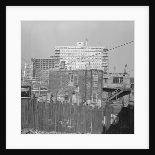 Modern Apartment Building Behind Slum Tenement in Chicago by Anonymous
