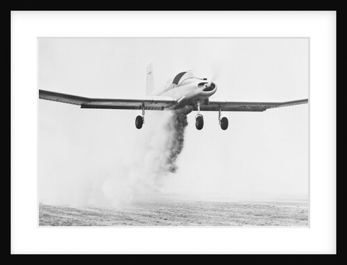 Crop Dusting Airplane in Flight by Anonymous