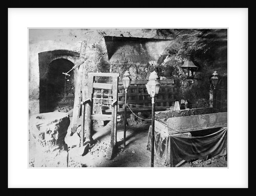 View of Torture Equipment in Cave Like Setting by Anonymous