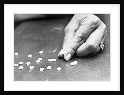 Hand Holding Pills Containing Thalidomide by Anonymous