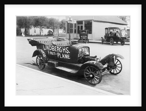 Early Model Car Parked at Station by Anonymous