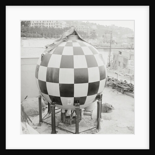 Checkered Steel Sphere Resting on Platform by Anonymous