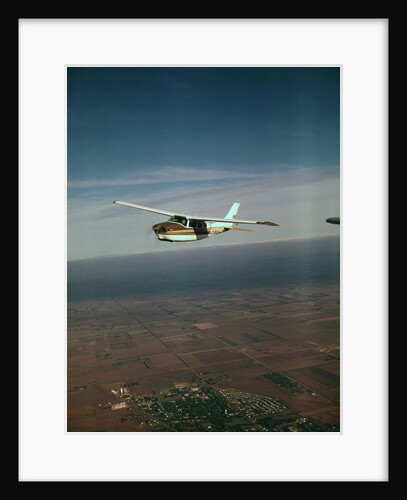 Cessna 210 Centurion Flying by Anonymous