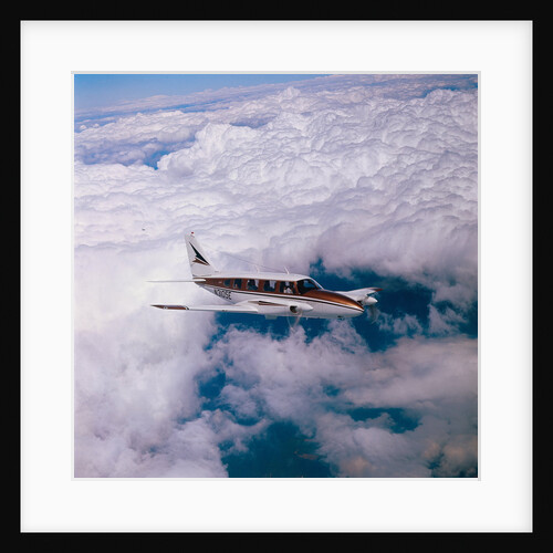 Navajo Piper Plane Flying by Anonymous