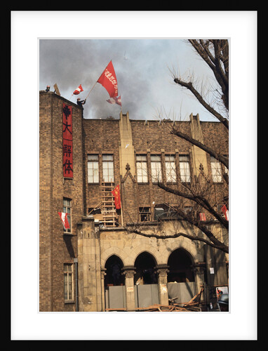 Student Waving Flag from Top of Building by Anonymous