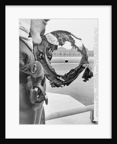 Burned Hat Framing Bullet Hole by Anonymous
