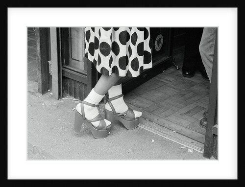 Woman Wearing High Platform Shoes by Anonymous