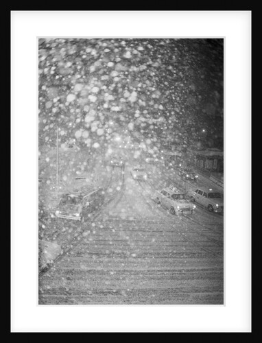 Traffic Slowly Moving Through Snow by Anonymous