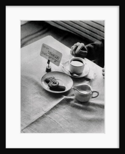 A Placard Being Placed on a Table by Anonymous