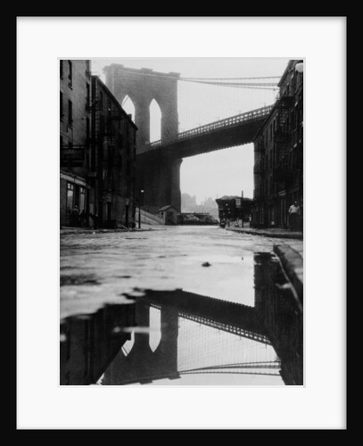 Puddle Reflecting Brooklyn Bridge by Anonymous