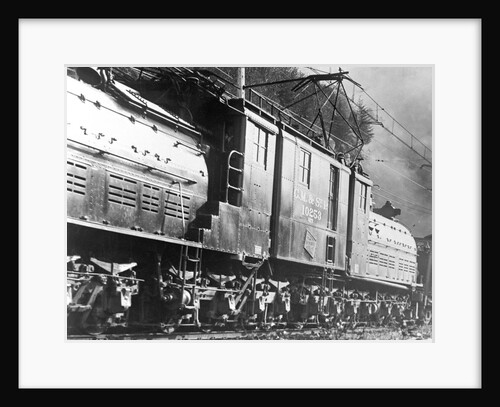 Steam Railroad Running Along Tracks by Anonymous