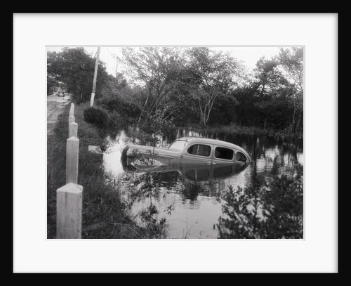 Water Reaching Windows of Car During Flood by Anonymous
