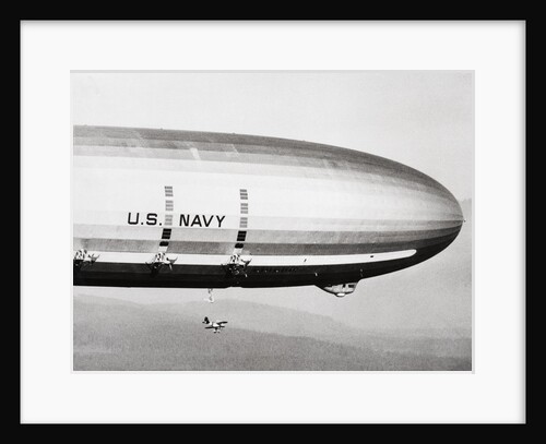 Plane Underneath Huge Dirigible in Flight by Anonymous