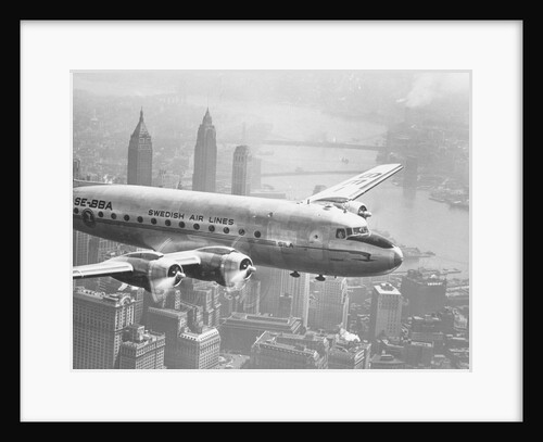 Aircraft Flying over City by Anonymous
