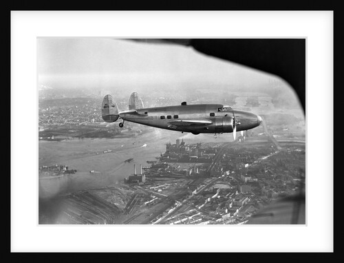 Howard Hughes Lockheed 14 Super Electra over New York City by Anonymous