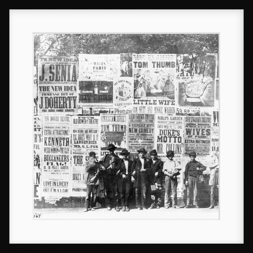 Boys Standing in Front of Posters by Anonymous
