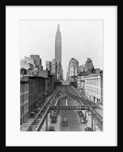 View of Empire State Building Beyond Elevated Train Tracks by Anonymous