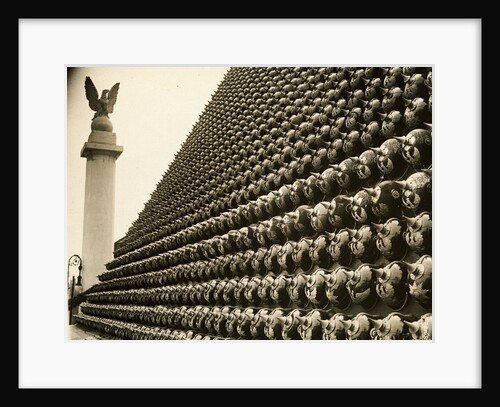 German Helmets Decorating Wall by Anonymous