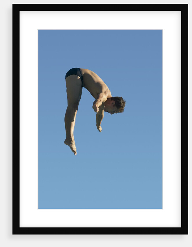 Profile shot of a young man diving by Anonymous