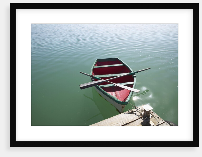 Rowing boat moored at the end of a jetty by Anonymous