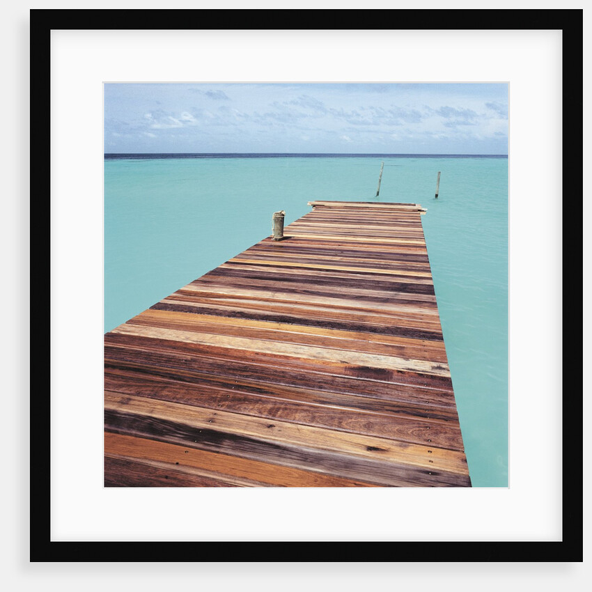 Wooden jetty leading out to sea by Anonymous