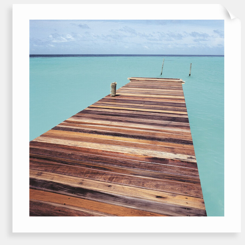 Wooden jetty leading out to sea by Anonymous