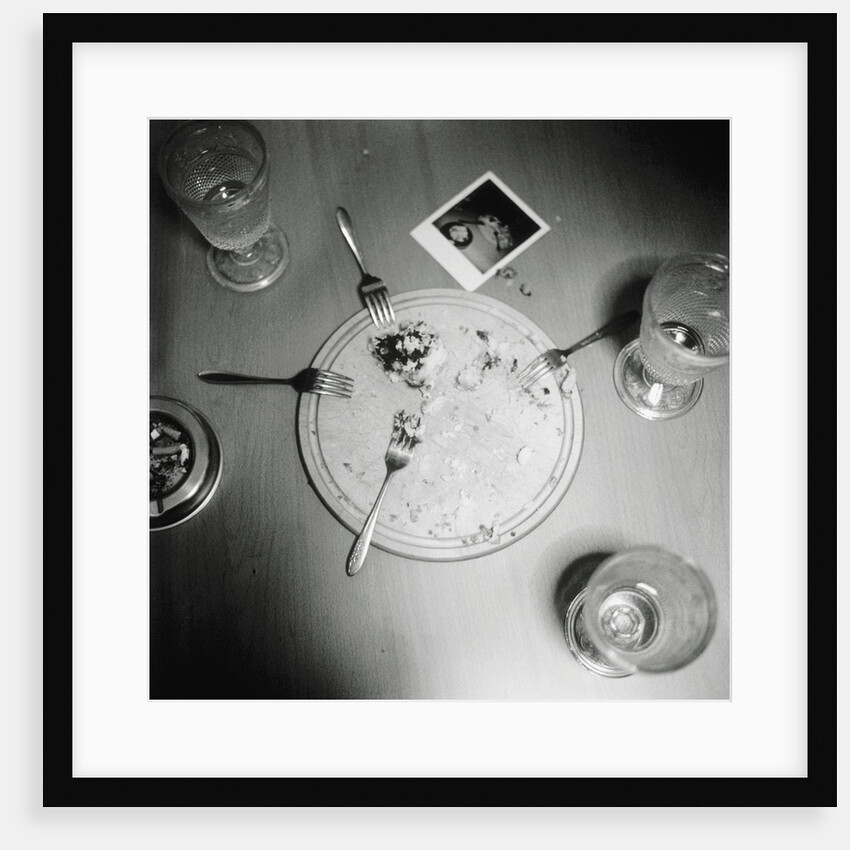Plate with forks and glasses on a table by Anonymous