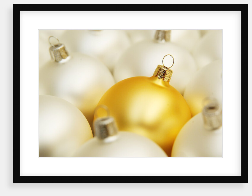 White Christmas tree decorations and a yellow one by Anonymous