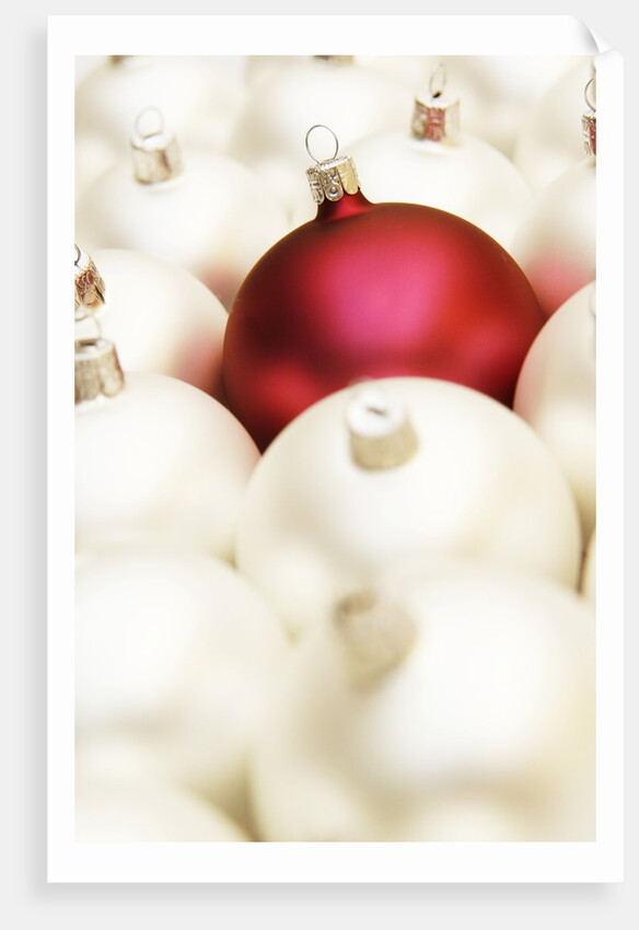 White Christmas tree decorations and a red one by Anonymous