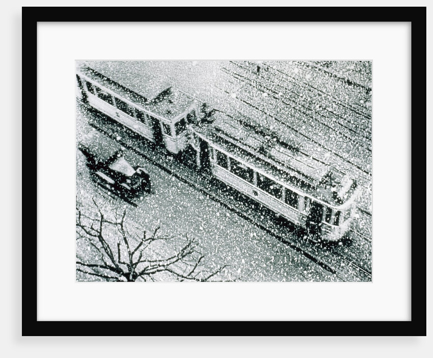 Urban traffic during snowfall, historic photo by Anonymous