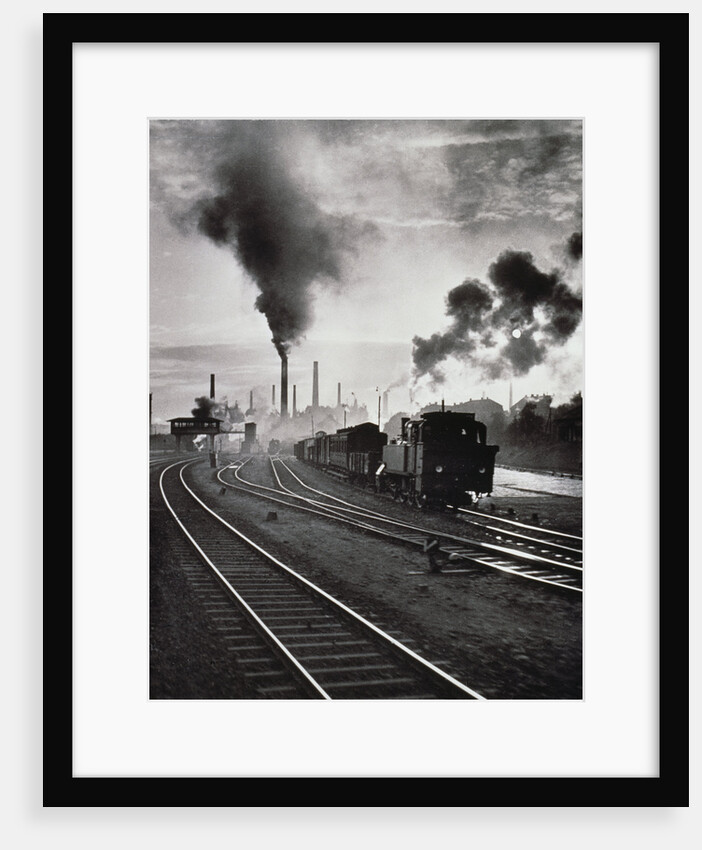 Freight train in front of smoking chimney stacks, nostalgia by Anonymous