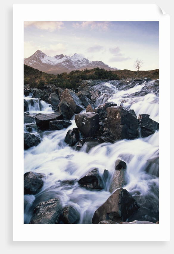 View of a river running over rocks by Anonymous