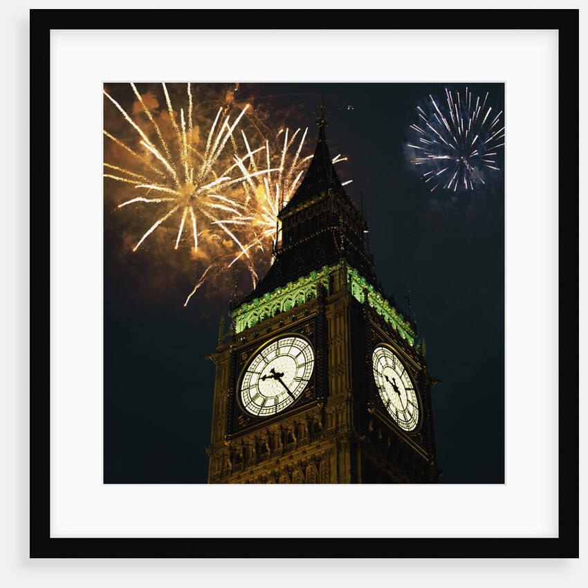 Low angle view of Big Ben, London, England, with fireworks bursting overhead by Anonymous