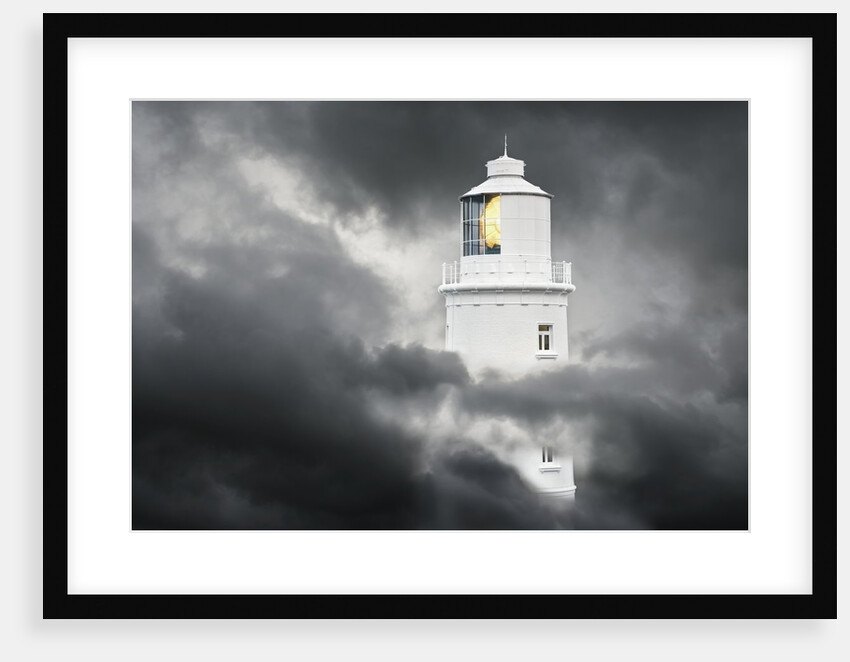 Lighthouse Emerging From Dark Clouds by Anonymous