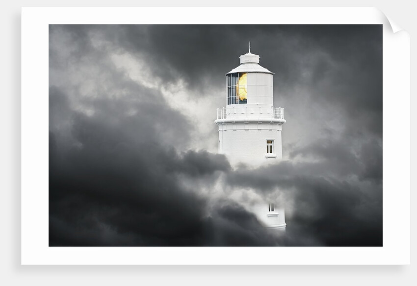 Lighthouse Emerging From Dark Clouds by Anonymous