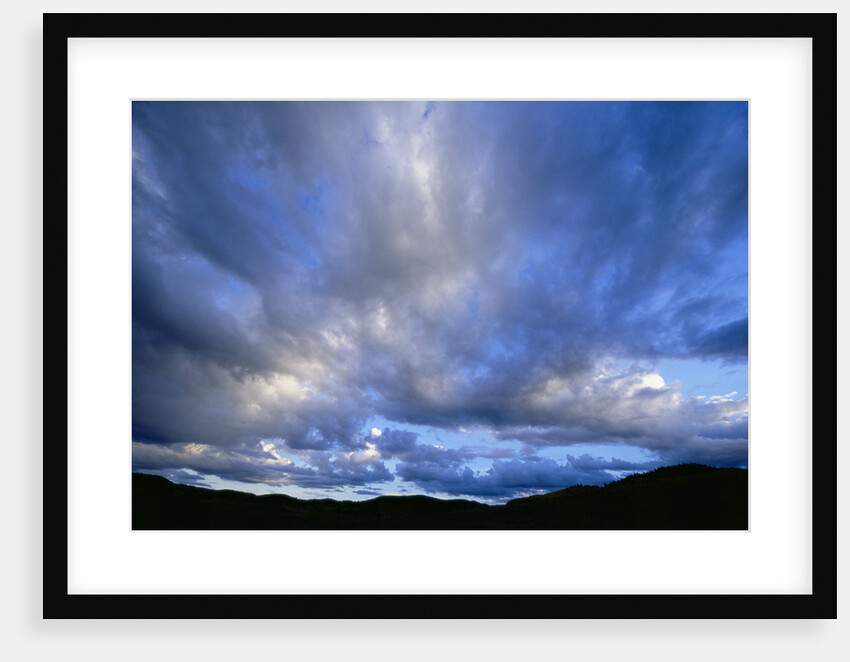 Cumulus Clouds over Mountain Range by Anonymous