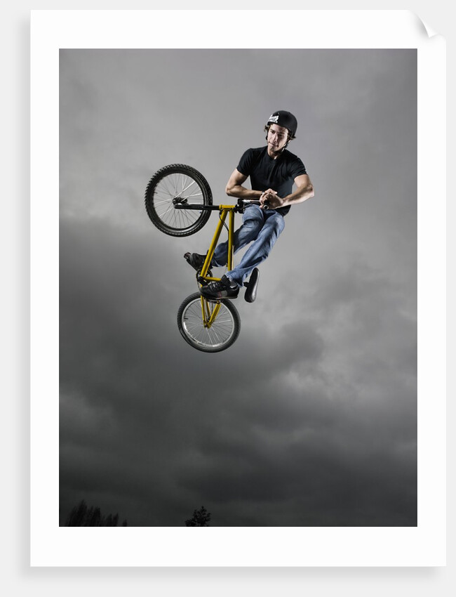 BMX Biker Performing Tricks by Anonymous