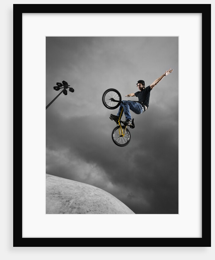 BMX Biker Performing Tricks by Anonymous