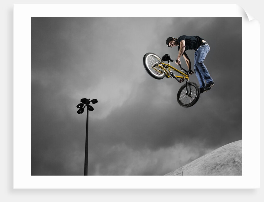 BMX Biker Performing Tricks by Anonymous